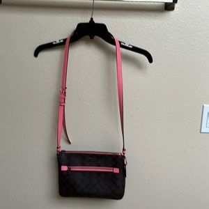 A Coach purse, 2 colors tone, dark brown and salmon.  Excellent condition